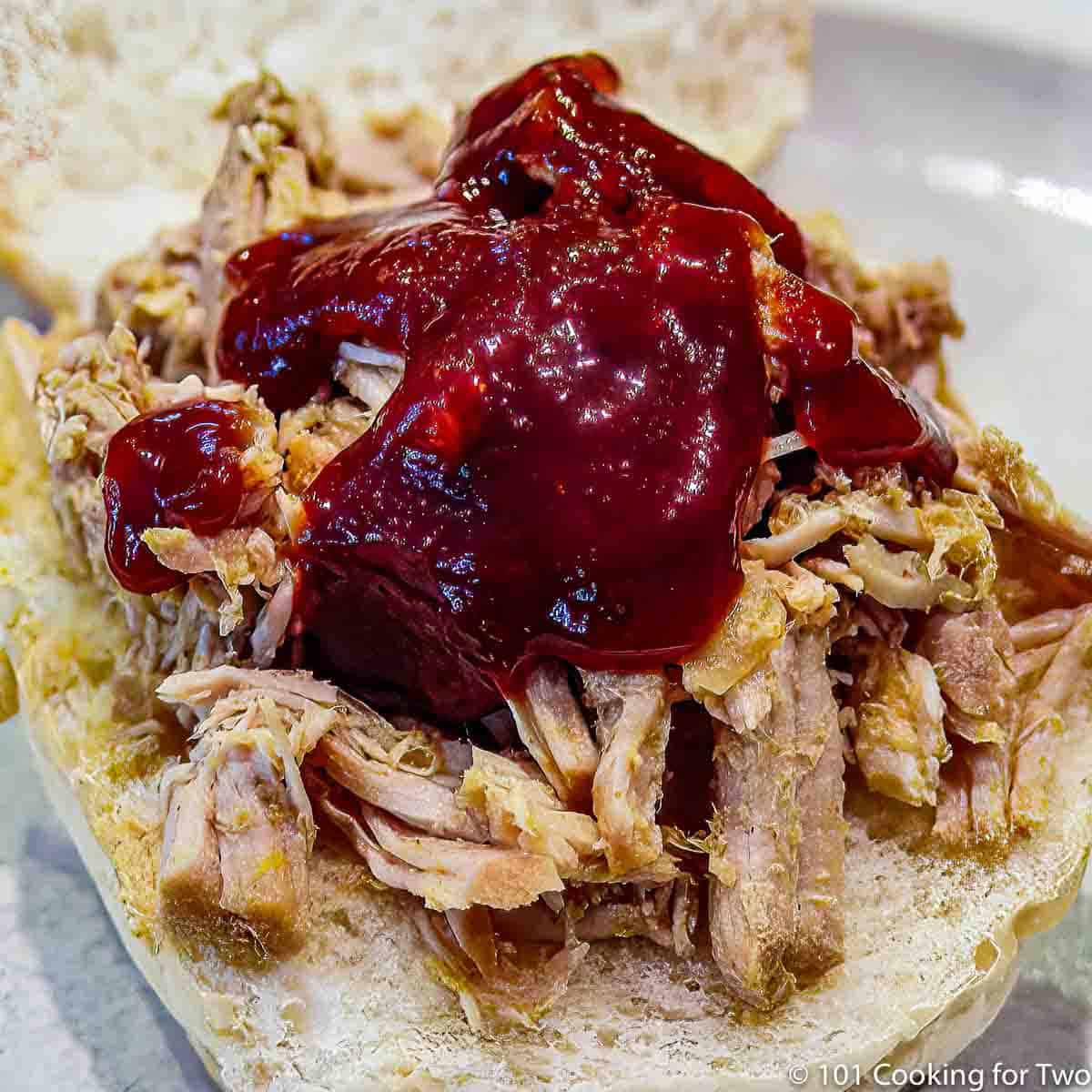 shredded pork loin on a bun with sauce