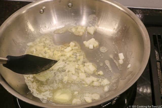 image of cooking onion in butter in a large skillet