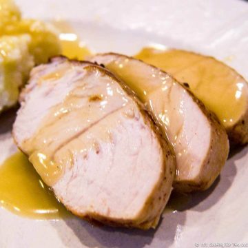 image of cut turkey with gravy on plate