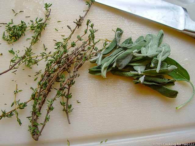 image of fresh herbs on a white cutting board
