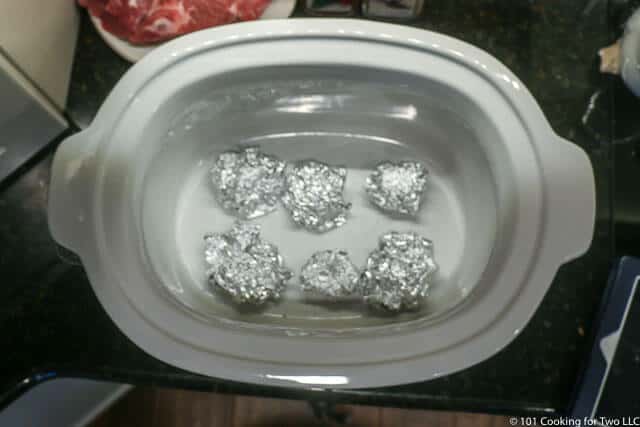 image of balls of foil in crock pot