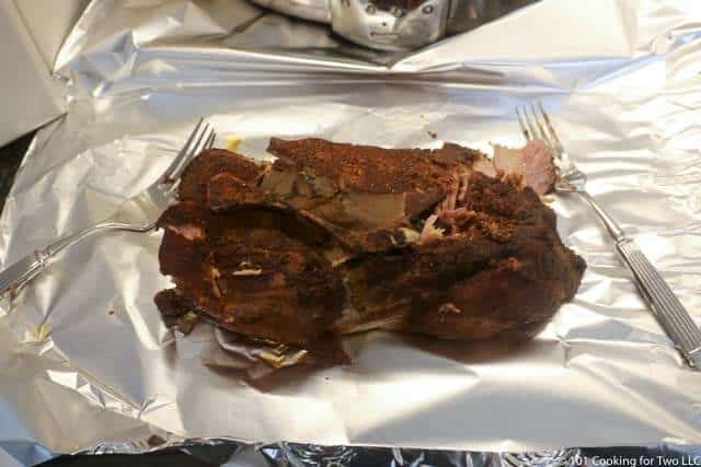 image of a cooked pork butt on a large piece of foil