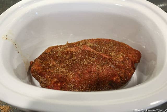 image of the pork butt placed in the crock pot