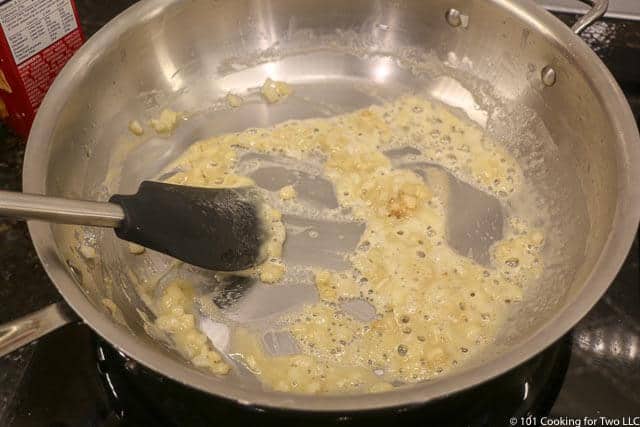 image of mixing the roux in the skillet with the onion and butter