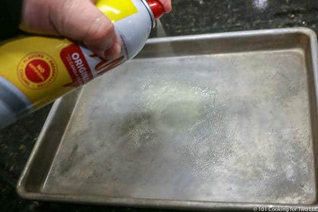image of spraying a 1/4 sheet pan with PAM