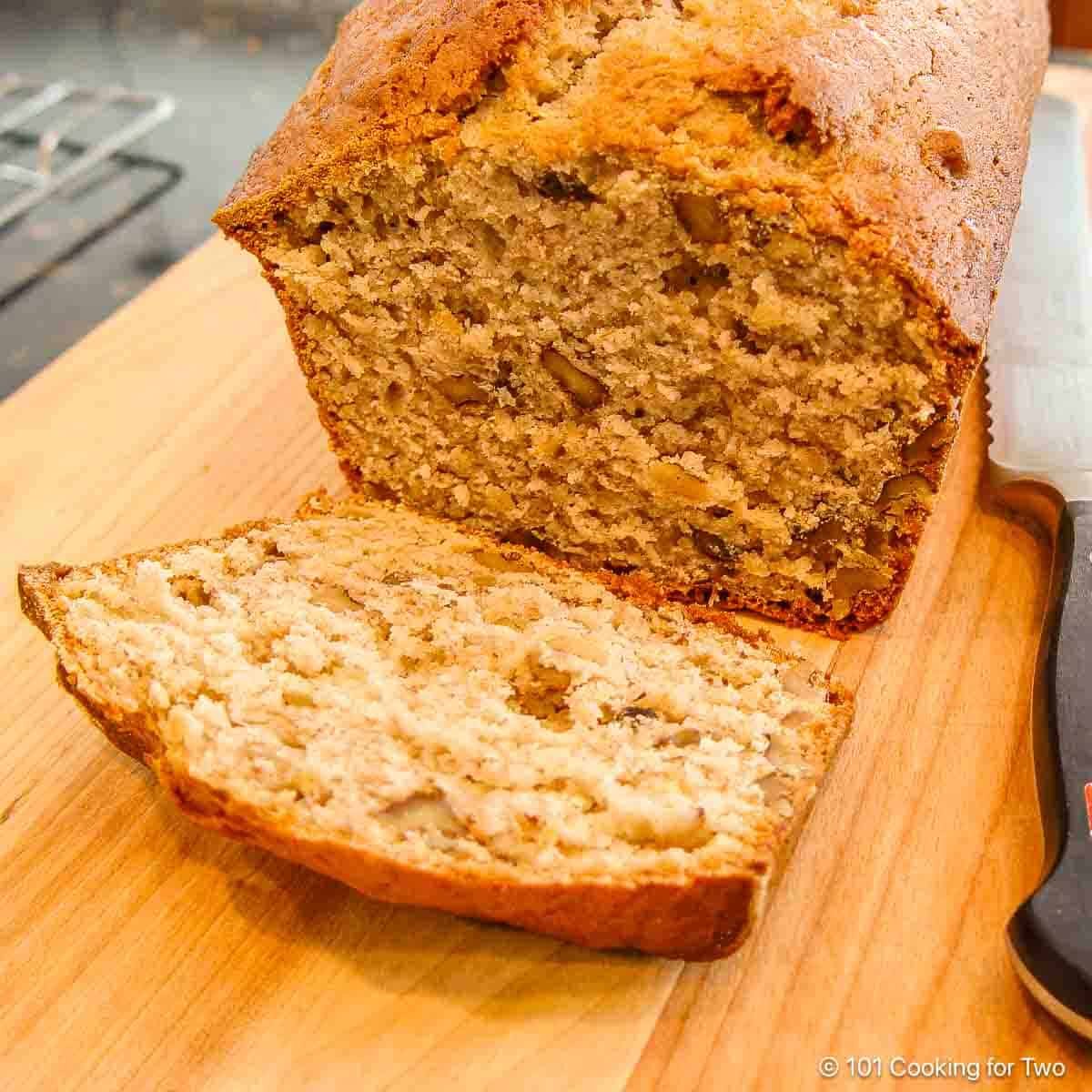 image of a loaf of banana nut bread on a cutting board