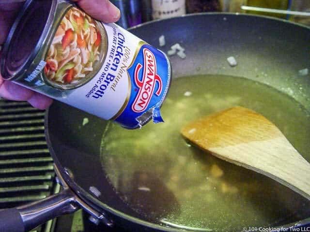 image of adding chicken broth to the pan