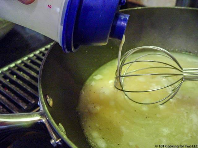 image of wisking flour mixture into the broth