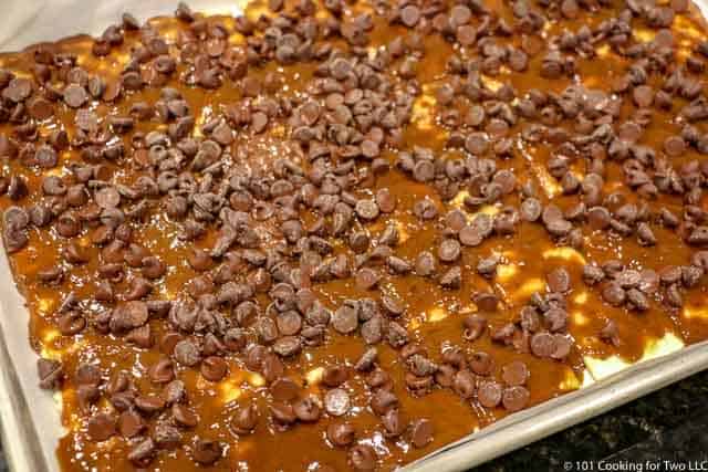 image of chocolate chips spread over the hot pan