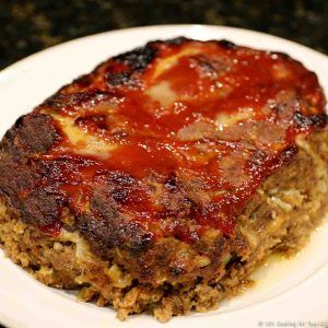 whole meatloaf on a white plate