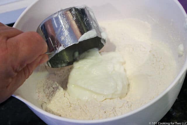 adding yogurt to the dry ingredients
