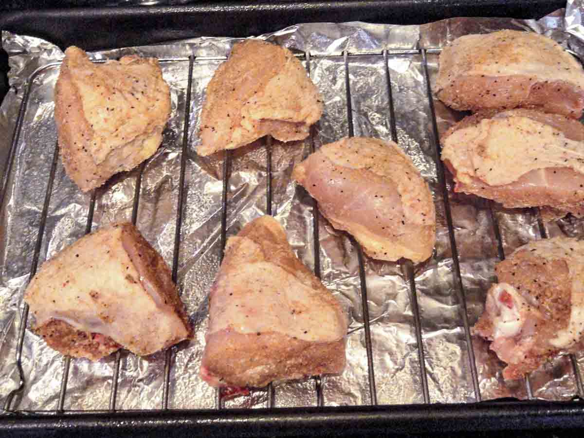 chicken pieces on rack ready for oven.