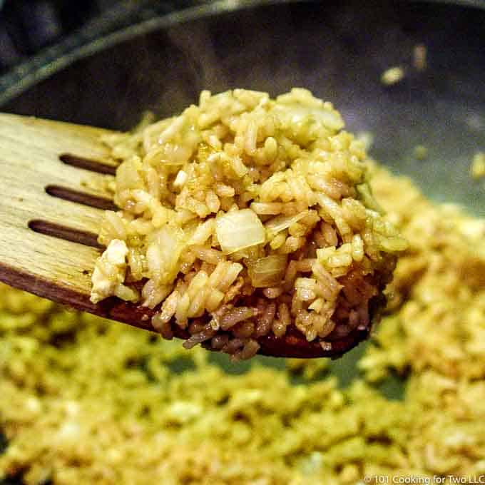 fried rice on a wooden spoon