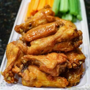 Baked chicken wings on a white platter