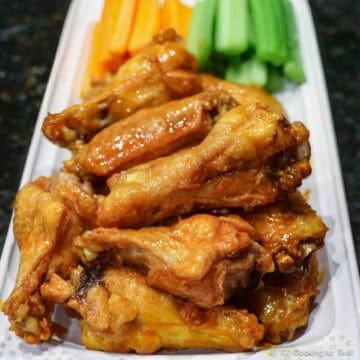 Baked chicken wings on a white platter