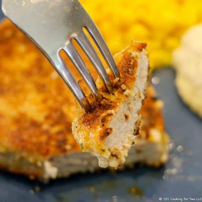 image of breaded pork chop on a fork