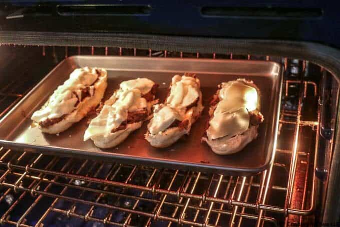 image of sandwich halfs with cheese under the broiler