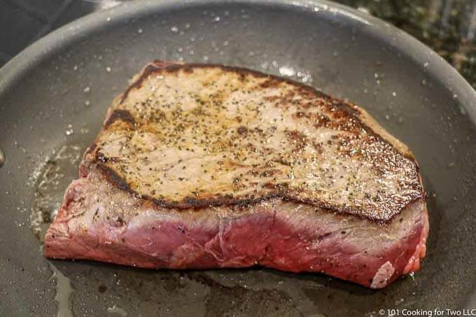 image of seared beef in a gray pan 680