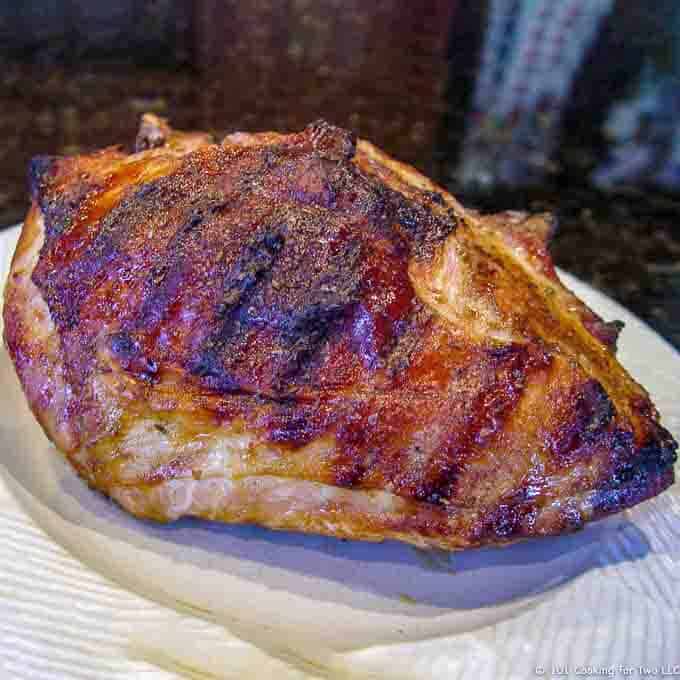 image of a cooked turkey breast with grill marks on a white plate