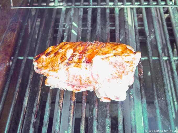 Image of a partly done turkey breast on the grill