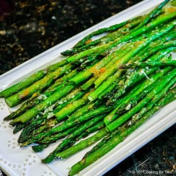 asparagus on white platter.