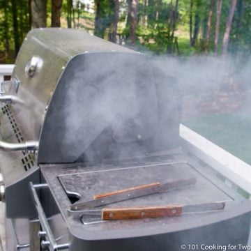 image of a smoking gas grill