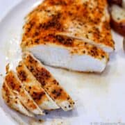 baked chicken breast on a white plate