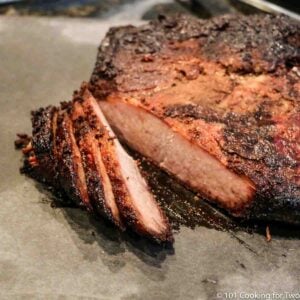 Cooked brisket on a gray board