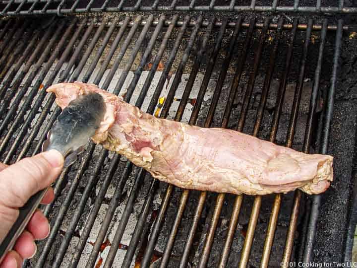 placeing the tenderloin on the grill