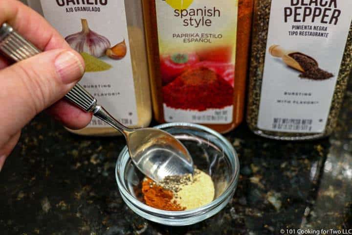 mixing spices in a small bowl