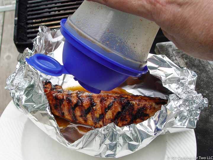 tenderloin in foil boat adding marinade