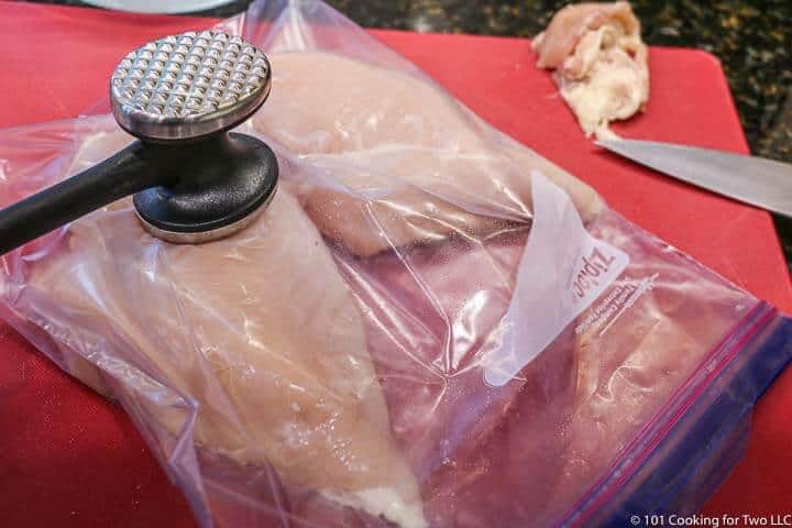 using a mallet to thin chicken breasts