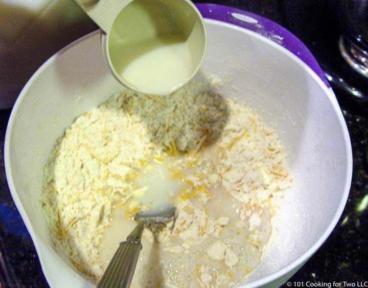 adding milk to dry mix