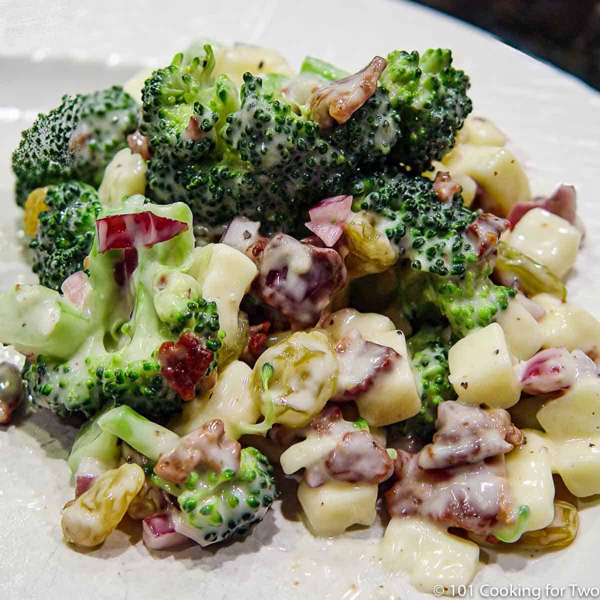 broccoli salad on white plate.