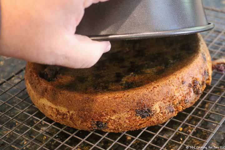 flipping the cake onto a cooling rack