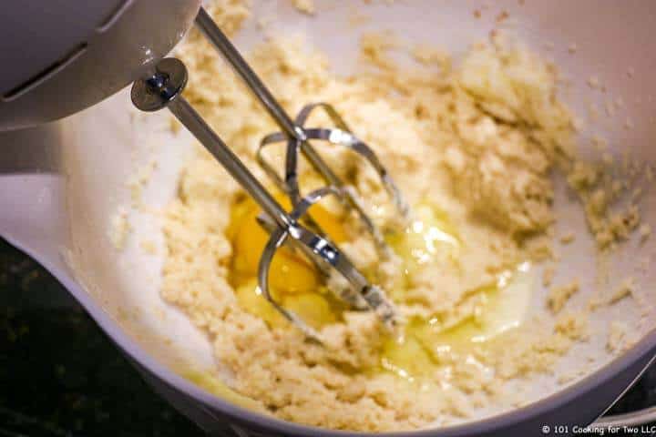 mixing in egg with hand mixer