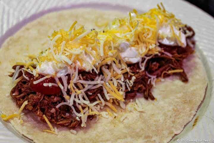 shredded beef on tortilla