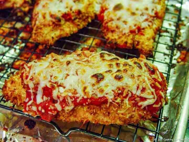 browned chicken parmesan on tray
