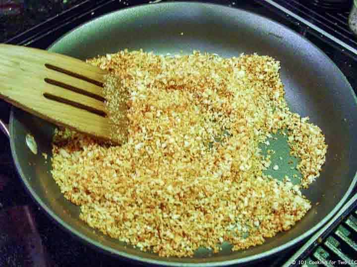 browning bread crumbs in skillet.