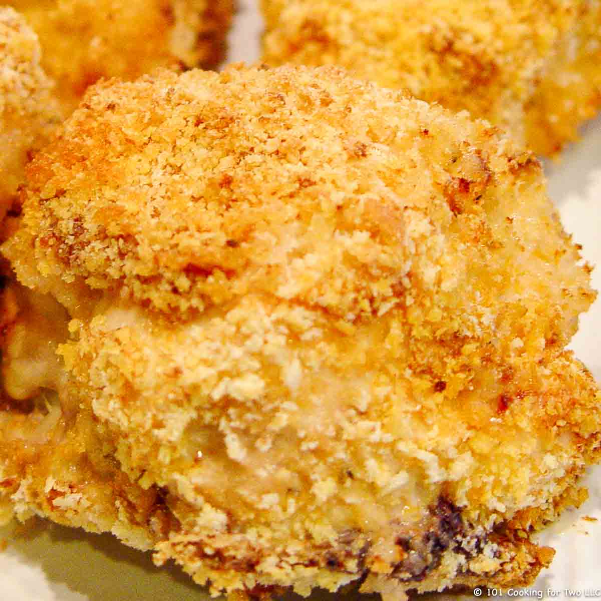 Oven Baked Mayonnaise Parmesan Split Chicken Breast on plate.