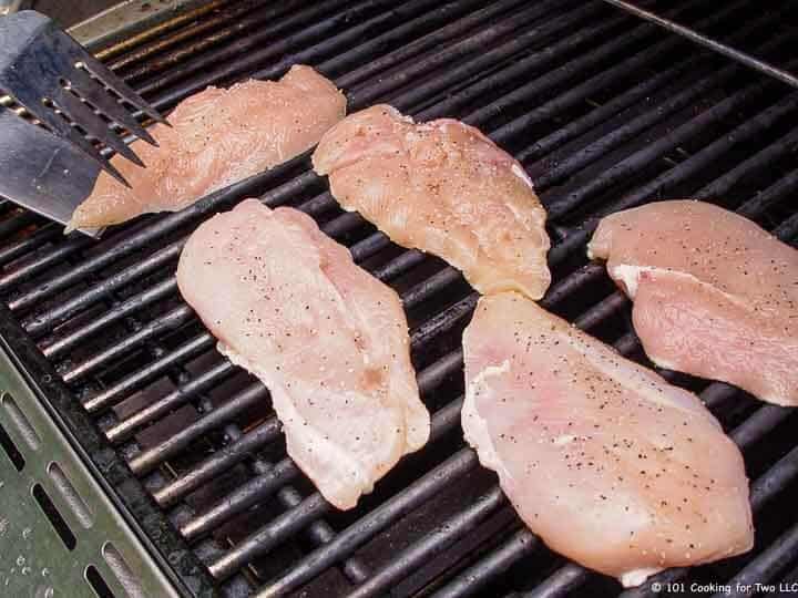 chicken on grill grates.