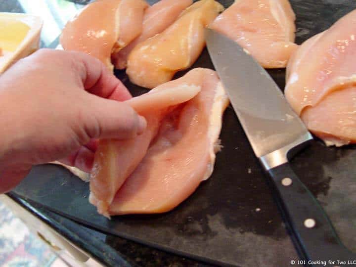 cutting chicken into cutlets.
