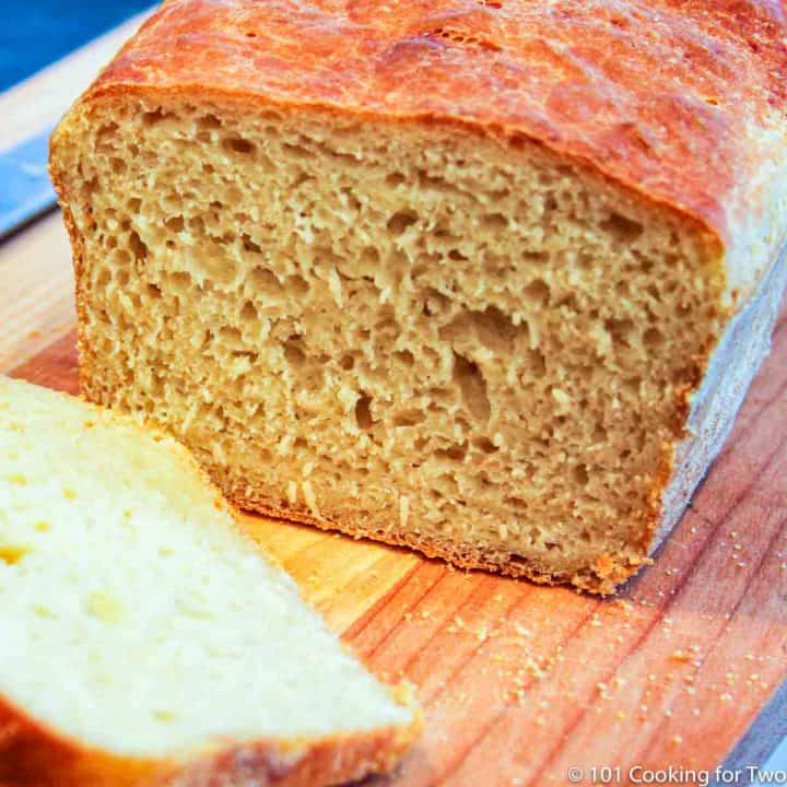 English muffin bread sliced on wooden board