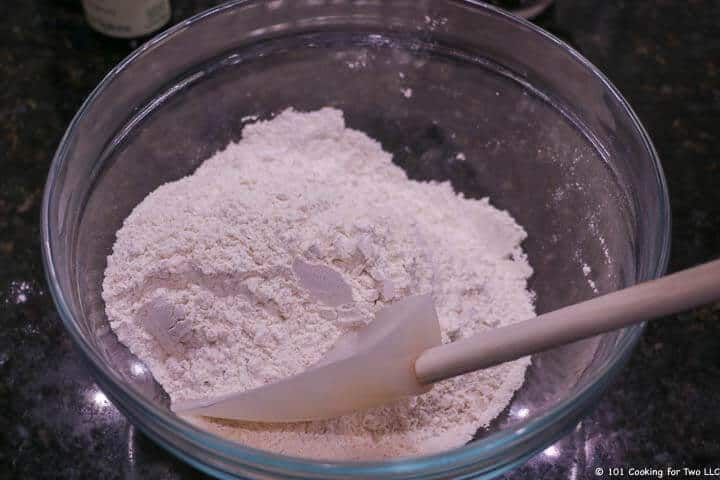 Combining the dry ingredients in a glass bowl.