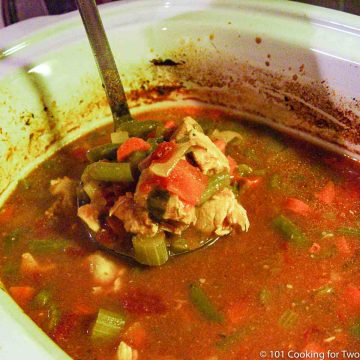 chicken vegetable soup in ladle