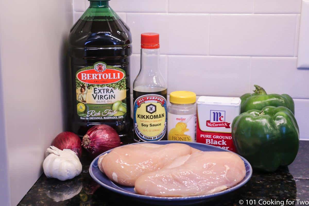 raw chicken and ingredients for kabobs.