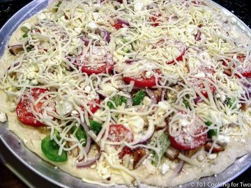 white pizza on pan ready for oven