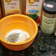 Mixing Chipotle seasoning in orange bowl