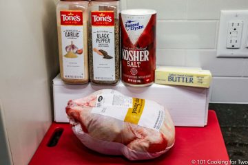 a whole chicken with butter and seasonings
