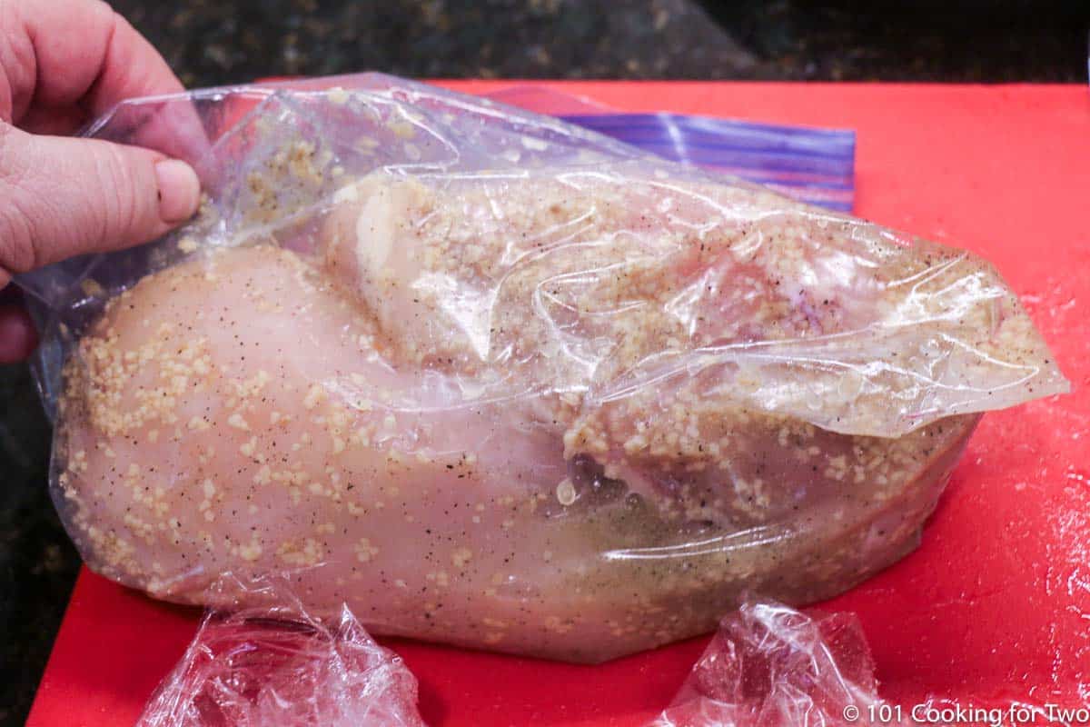 chicken in marinade in bag